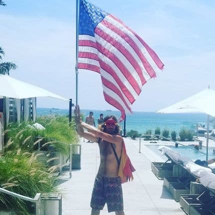 Glen Bradford holding the American flag